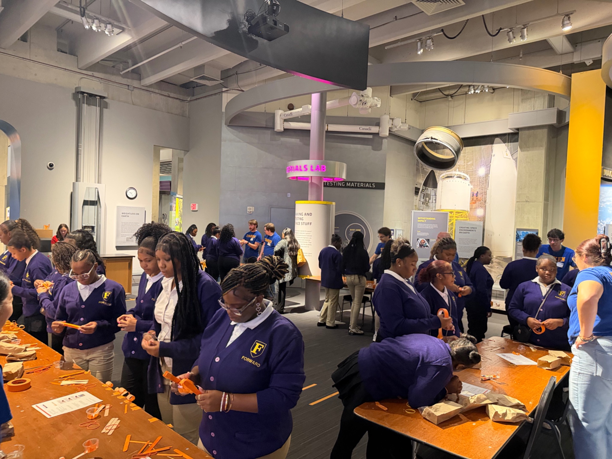 Students exploring materials through hands-on activities