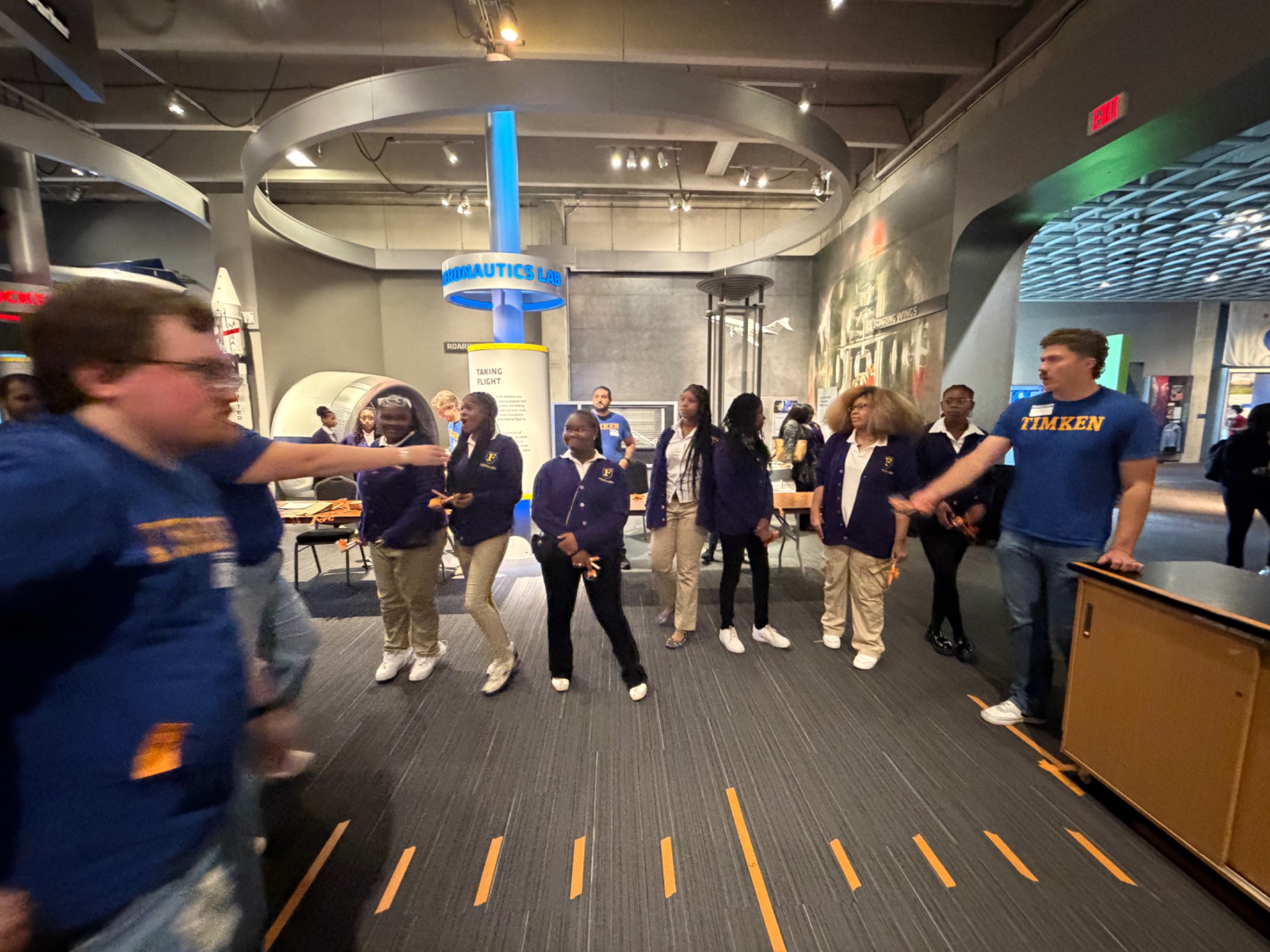 Students gathered for an exhibit demonstration