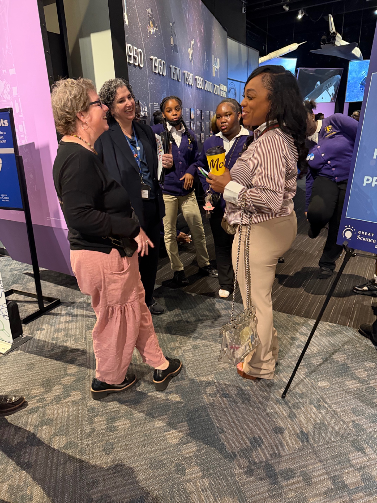 FORWARD community members and students visiting a science exhibit