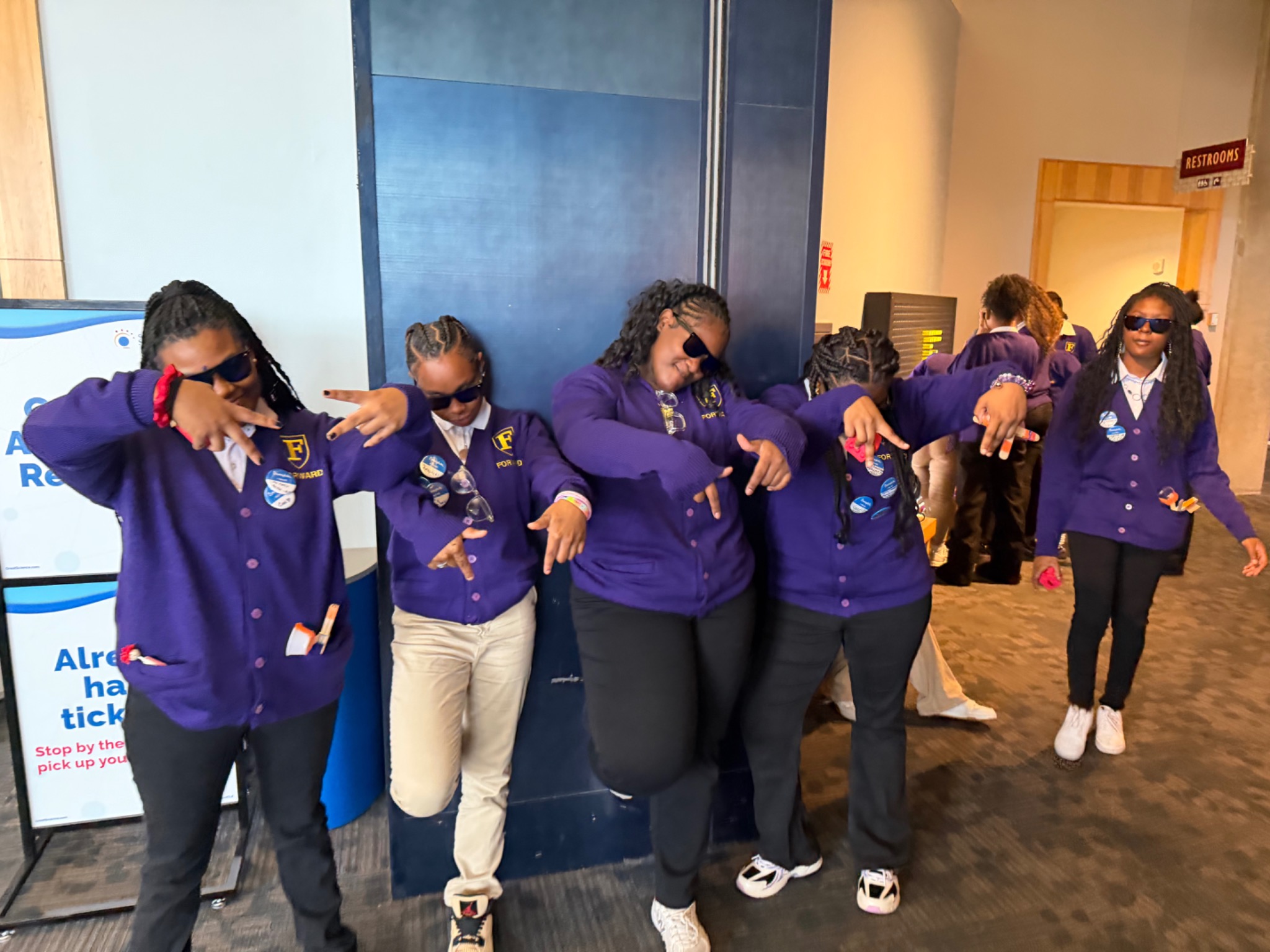 FORWARD students posing together in purple uniforms