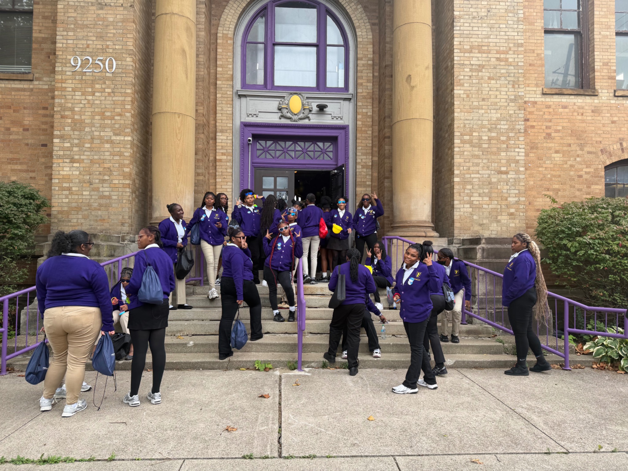 FORWARD students together outside the school entrance